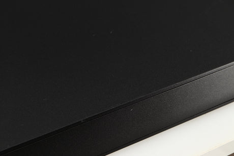 Close up of a used Naim NAC112 Pre Amplifier in a black finish showing scratching on top