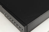 Close up of a used Naim NAC112 Pre Amplifier in a black finish showing scratching on top