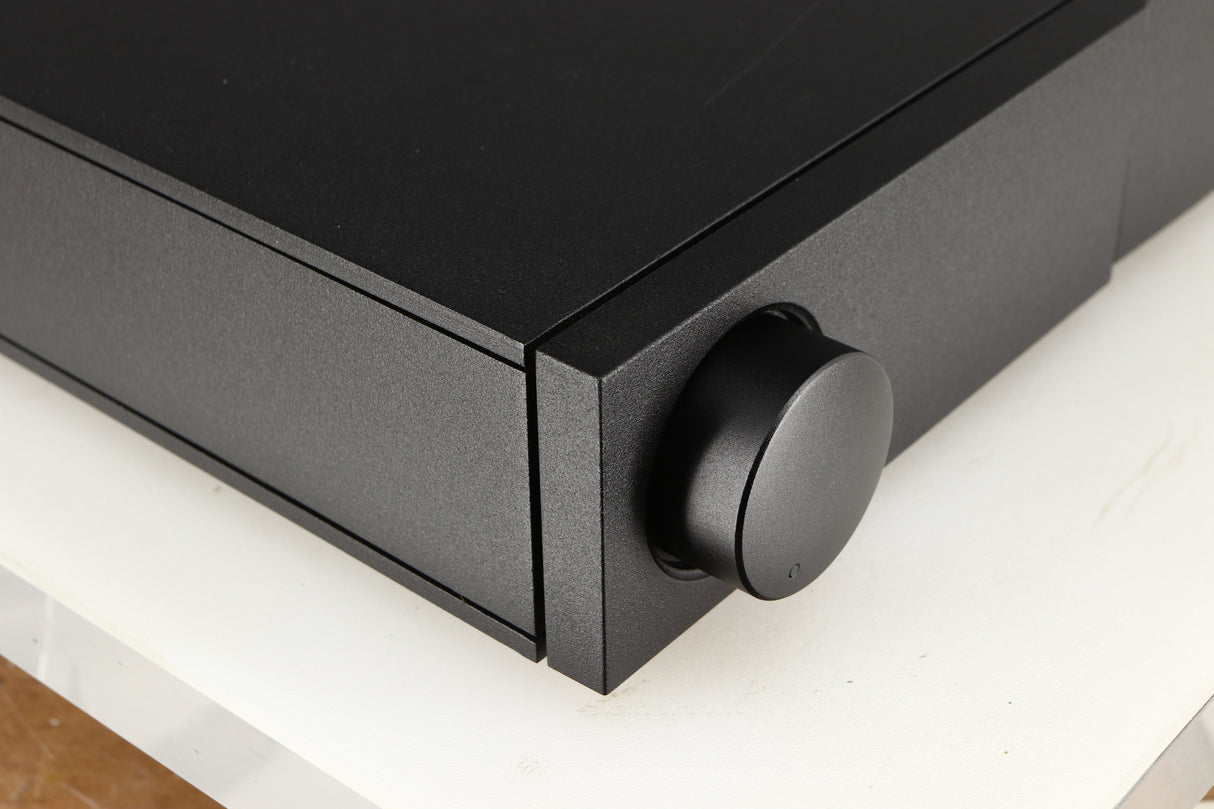 Front left corner of a used Naim NAC112 Pre Amplifier in a black finish
