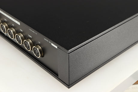 Rear left corner of a used Naim NAC112 Pre Amplifier in a black finish