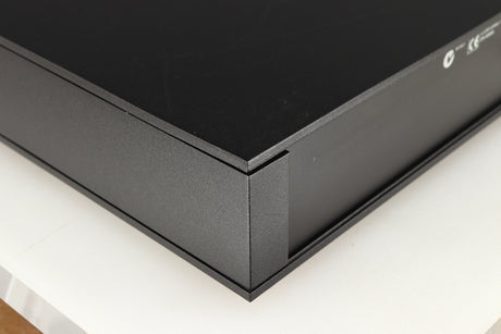 Rear right corner of a used Naim NAC112 Pre Amplifier in a black finish