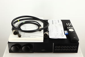 Top of a used Naim NAC252 Pre Amplifier in a black finish showing Remote, Batteries, Burndy Cable, SNAIC5 and Manuals