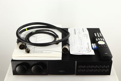 Top of a used Naim NAC252 Pre Amplifier in a black finish showing Remote, Batteries, Burndy Cable, SNAIC5 and Manuals