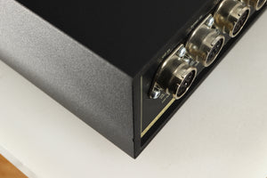 Close up of a used Naim NAC252 Pre Amplifier in a black finish showing small chip on rear right corner