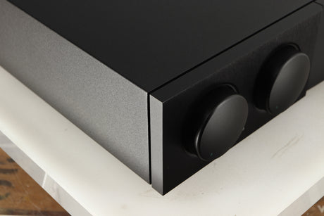 Front left corner of a used Naim NAC252 Pre Amplifier in a black finish