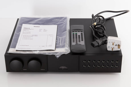 Top of a used Naim NAC282 Pre Amplifier in a Black finish showing Manual, Remote and Mains Cable