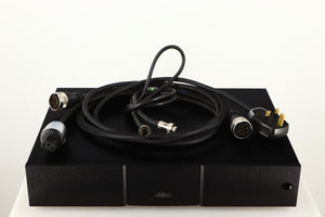 Top of a used Naim 552PS Power Supply in a black finish showing Burndy Cable, Mains Cable and SNAIC5