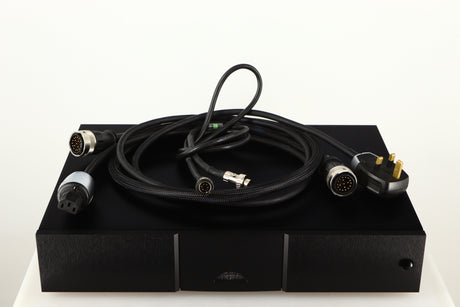 Top of a used Naim 552PS Power Supply in a black finish showing Burndy Cable, Mains Cable and SNAIC5