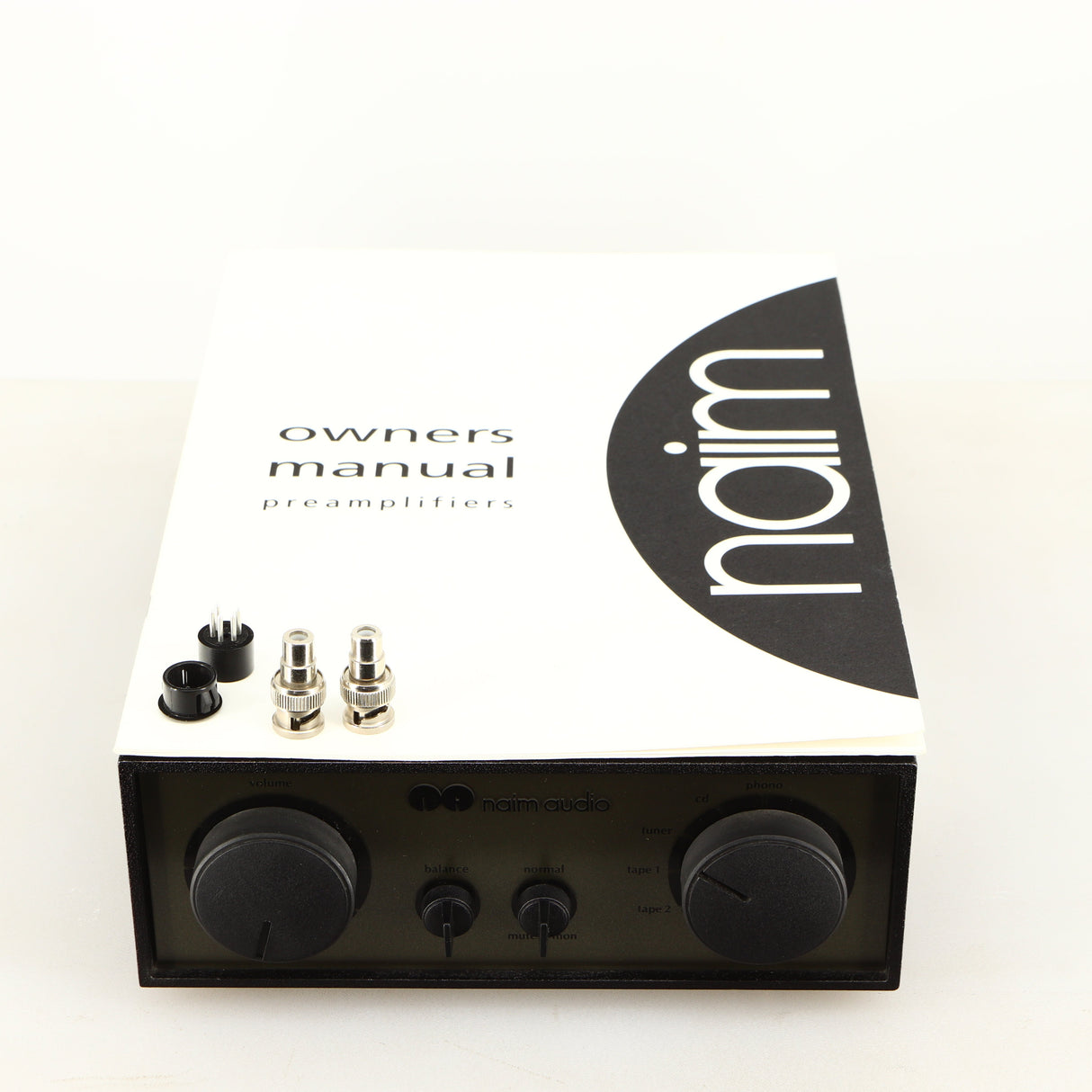 Top of a used Naim NAC72 Pre Amplifier in a black finish showing Manual and 2x BNC Connectors