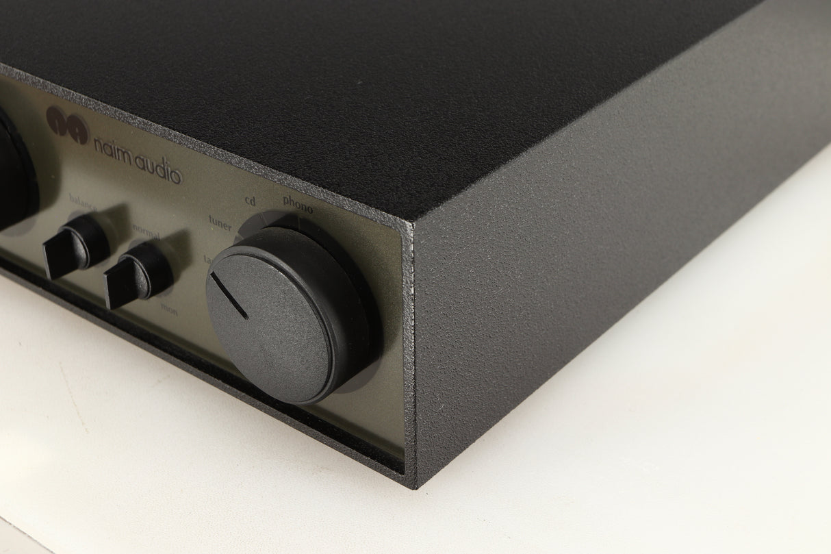Front right corner of a used Naim NAC72 Pre Amplifier in a black finish