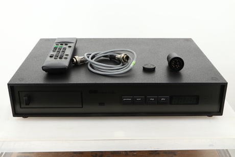 View of a used Naim NACDX CD Player showing Remote, SNAIC, CD Puck, and Burndy plug