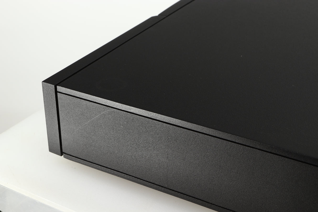 Close up of a used Naim NAIT 5 Integrated Amplifier in a black finish showing some scratching