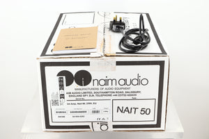 Box of a used Naim Nait 50 Integrated Amplifier showing mains cable, and manual