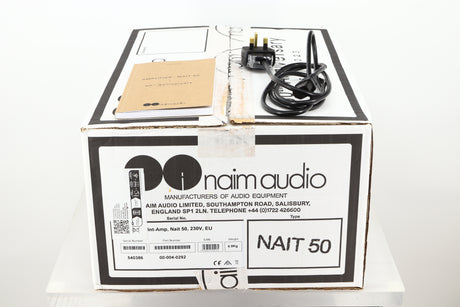 Box of a used Naim Nait 50 Integrated Amplifier showing mains cable, and manual