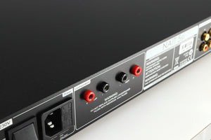 Close up of a used Naim NAIT 5si Integrated Amplifier in a black finish showing scratching on the rear