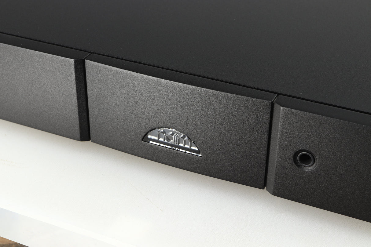 Close up of a used Naim NAIT 5si Integrated Amplifier in a black finish showing the logo