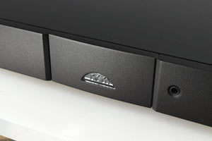 Close up of a used Naim NAIT 5si Integrated Amplifier in a black finish showing the logo