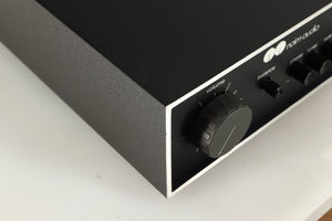 Front left corner of a used Naim NAIT Integrated Amplifier in a black finish