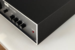 Front right corner of a used Naim NAIT Integrated Amplifier in a black finish