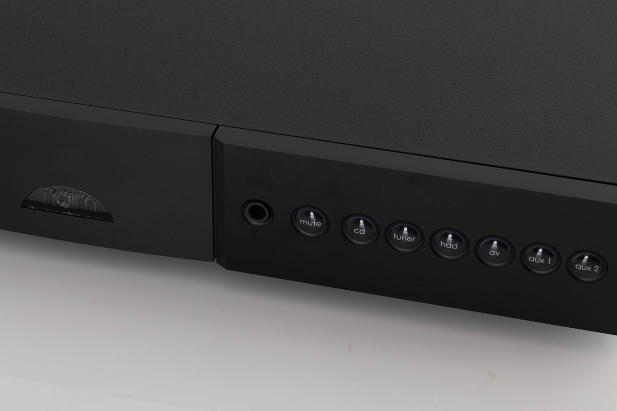 Close up of a used Naim Nait XS-2 Integrated Amplifier in a Black finish showing very light marks on fascia