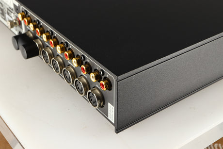 Rear left corner of a used Naim Nait XS-2 Integrated Amplifier in a black finish