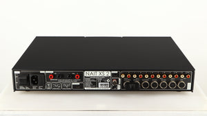 Rear view of a used Naim Nait XS-2 Integrated Amplifier in a black finish showing Phono Inputs, Phono Outputs, USB Input, Speaker Outputs, Mains Input, XLR Inputs and XLR Outputs