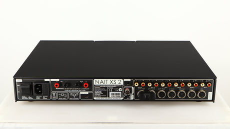 Rear view of a used Naim Nait XS-2 Integrated Amplifier in a black finish showing Phono Inputs, Phono Outputs, USB Input, Speaker Outputs, Mains Input, XLR Inputs and XLR Outputs