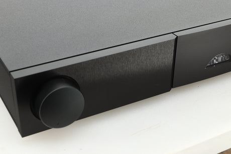 Close up view of a used Naim Nait XS-3 Integrated Amplifier showing the left side of the fascia