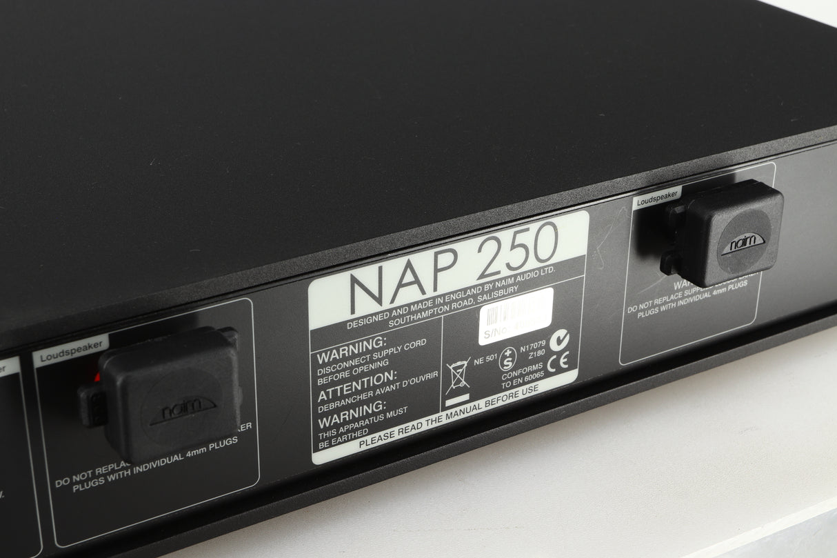 Close up of a used Naim NAP 250 Power Amplifier in a black finish showing scratches on the rear
