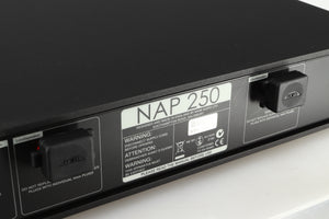 Close up of a used Naim NAP 250 Power Amplifier in a black finish showing scratches on the rear