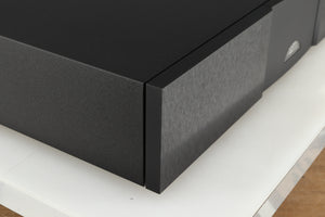 Front left corner of a used Naim NAP 250 Power Amplifier in a black finish
