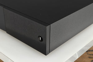 Front right corner of a used Naim NAP 250 Power Amplifier in a black finish