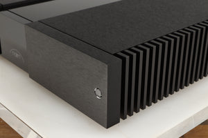 Front right corner of a used Naim NAP 250 Power Amplifier in a black finish