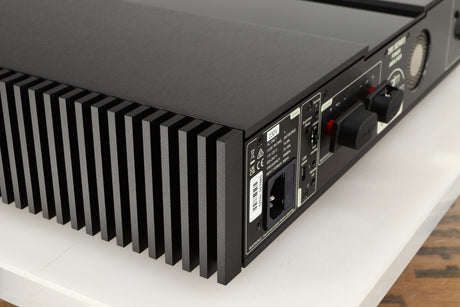 Rear right corner of a used Naim NAP 250 Power Amplifier in a black finish