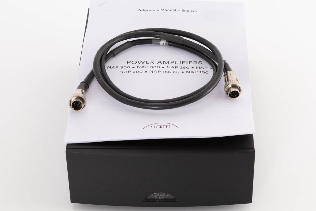 Top of a used Naim NAP100 Power Amplifier in a Black finish showing SNAIC4 and Manual