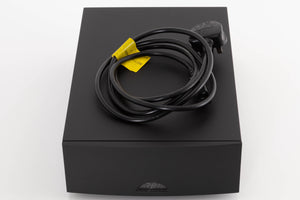 Top of a used Naim NAP100 Power Amplifier in a Black finish showing Mains Cable