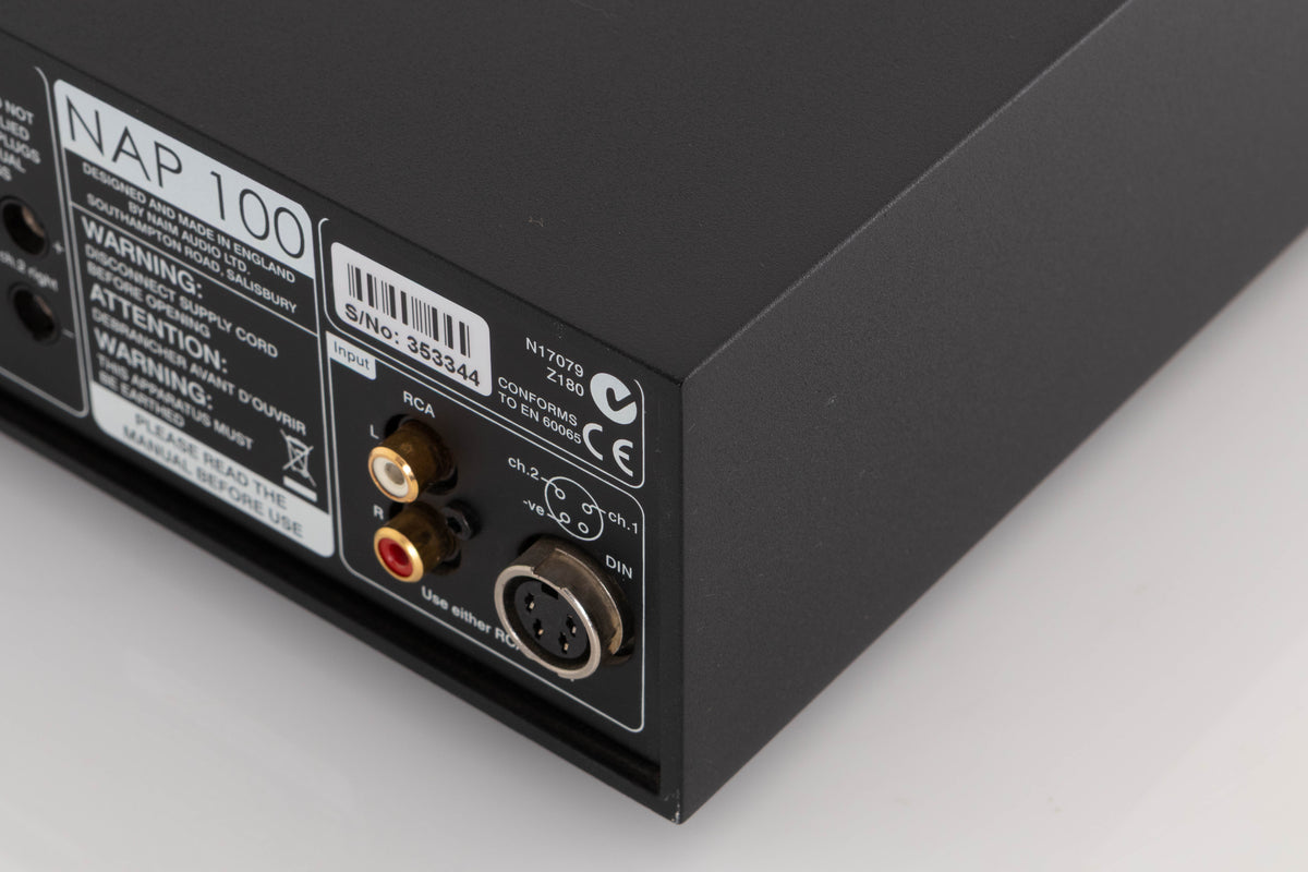 Rear left corner of a used Naim NAP100 Power Amplifier in a Black finish