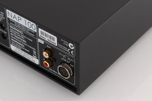 Rear left corner of a used Naim NAP100 Power Amplifier in a Black finish