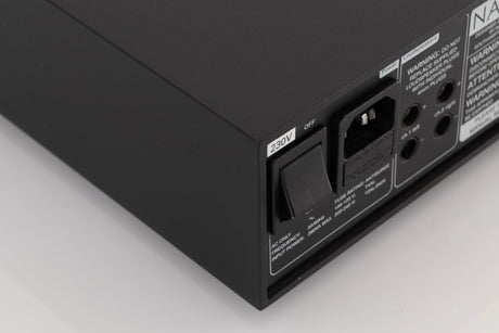 Rear right corner of a used Naim NAP100 Power Amplifier in a Black finish