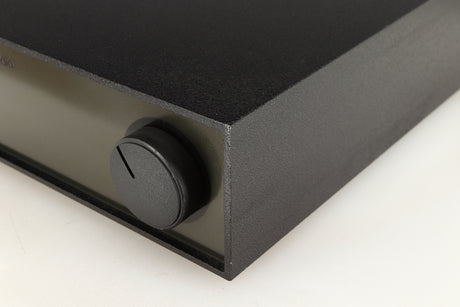 Front right corner of a used Naim NAP140 Power Amplifier in a black finish