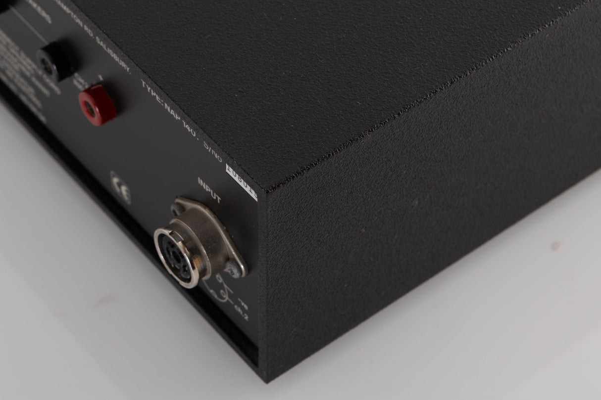 Rear left corner of a used Naim NAP140 Power Amplifier in a Black finish