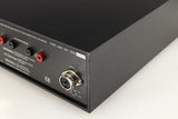 Rear left corner of a used Naim NAP140 Power Amplifier in a black finish
