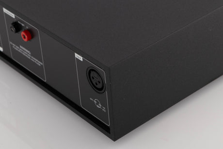 Rear left corner of a used Naim NAP250-2 Power Amplifier in a Black finish