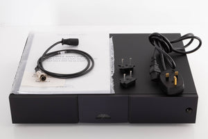 Top of a used Naim NAP250 DR Power Amplifier in a Black finish showing Manual, SNAIC4, Mains Cable and Link Plugs