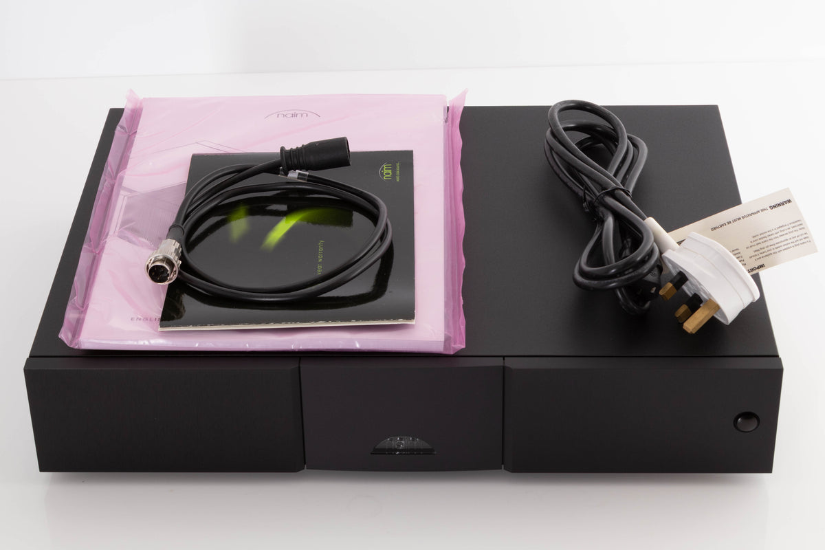 Top of a used Naim NAP250 DR Power Amplifier in a Black finish showing Manual, Mains Cable and SNAIC4