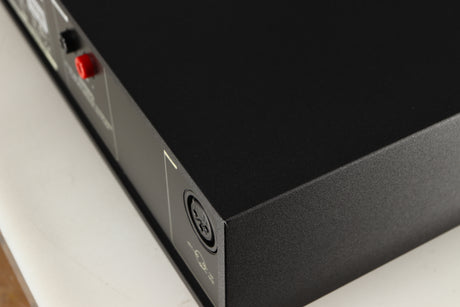 Close up of a used Naim NAP250 DR Power Amplifier in a black finish showing small nick on rear left corner