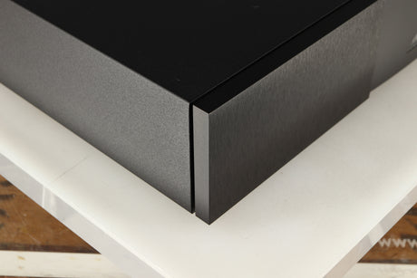 Front left corner of a used Naim NAP250 DR Power Amplifier in a black finish