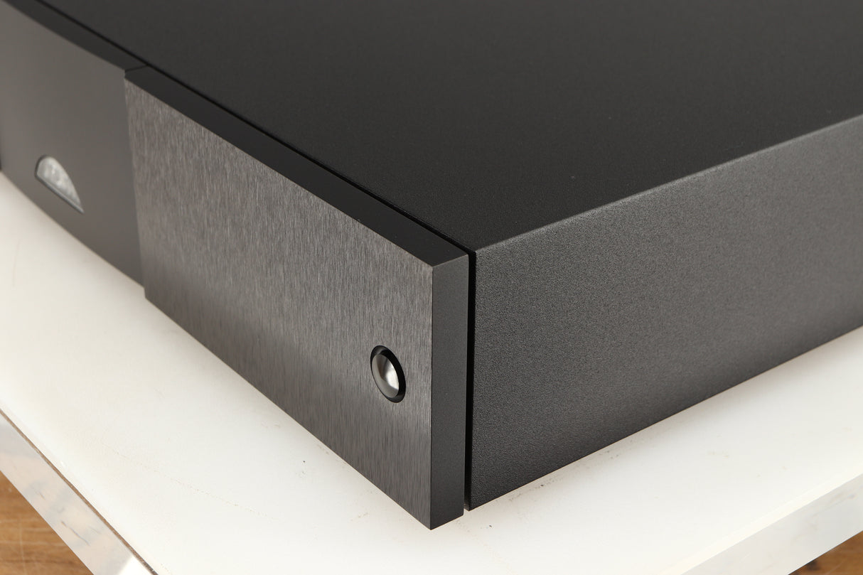 Front right corner of a used Naim NAP250 DR Power Amplifier in a black finish 