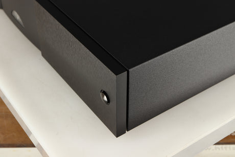 Front right corner of a used Naim NAP250 DR Power Amplifier in a black finish