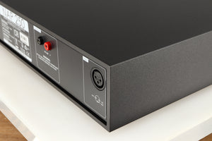 Rear left corner of a used Naim NAP250 DR Power Amplifier in a black finish 